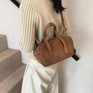 Brown vintage matte suede Boston bag with white stitching and crossbody strap