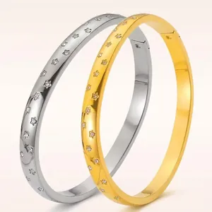 Star engraved stainless steel open bangle with crystals in gold and silver finish