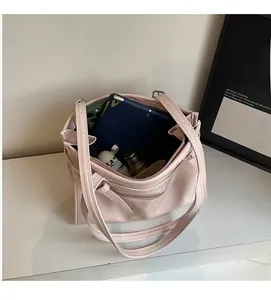 Interior view of large capacity tote bag showing storage for tablet and essentials