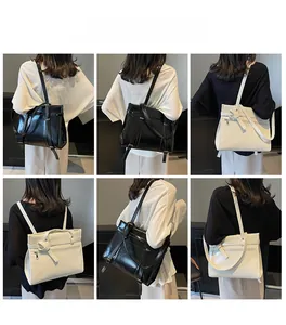 Detailed views of black and cream large tote bags styled as shoulder and back carry