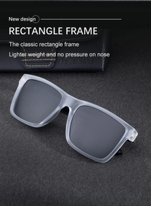 Close-up of matte clear rectangle sunglasses with dark lenses and leather case