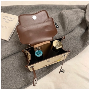 Detailed internal view of contrast stitching canvas crossbody bag with spacious storage