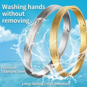 Titanium steel couple bracelets with engraved grid texture in gold and silver finish