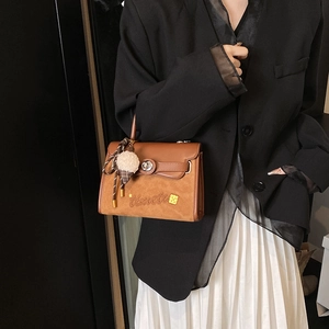Minimalist patchwork leather shoulder bag with vintage metal buckle and cute charm