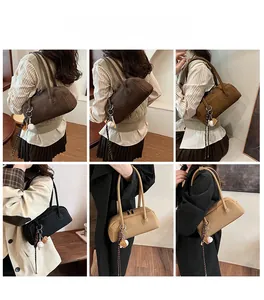 Detailed view of vintage baguette shoulder bags in multiple colors with charms