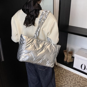Silver metallic geometric quilted tote bag with padded shoulder straps for winter