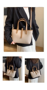 Detail of lychee pattern beige tote bag with light brown handles and golden hardware