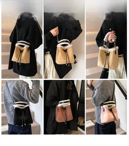 Detail view of suede bucket bags with faux shearling trim in various colors and carrying styles