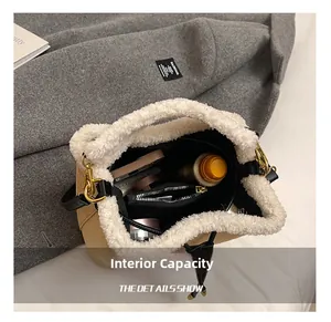 Top view of beige bucket bag showing interior capacity with cosmetics and fuzzy trim