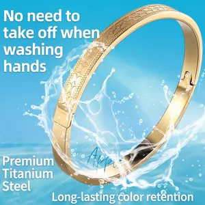 Polished gold titanium steel bracelet with engraved heart pattern and waterproof design