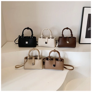 Close-up of minimalist square handbags in five colors with lychee grain leather texture