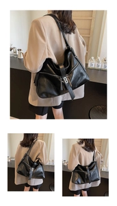 Vue détaillée du sac cabas en cuir noir avec fermetures éclair argentées et texture plissée