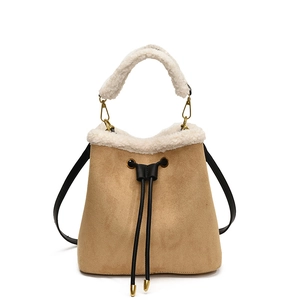 Khaki faux suede bucket bag with white faux fur trim and adjustable shoulder strap