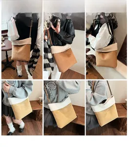 Dettaglio della borsa a secchiello in pile con texture scamosciata e vestibilità a tracolla