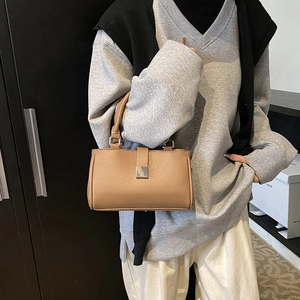 Chic camel leather square handbag with silver buckle and elegant top handle for women