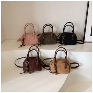 Five matte mini Boston bags in various colors displayed on white geometric stands
