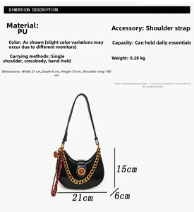 Detail of black crescent handbag with gold chain, silk scarf, and dimension labels