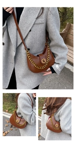 Detail of caramel brown hobo bag with golden chain and round metallic twist lock closure