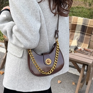 Chic dark brown moon-shaped shoulder bag with gold chain and crossbody leather strap