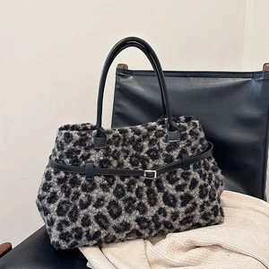 Winter faux fur leopard print tote bag with black leather straps and metal buckle