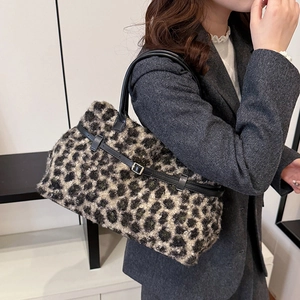 Winter faux fur leopard print tote bag with black leather straps and gold buckle