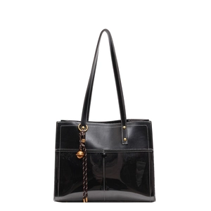 Large black winter tote bag with matte and patent leather patchwork for commuting