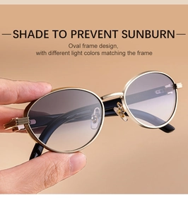 Detail of gold metal oval sunglasses frame with intricate decorative textures