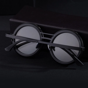 Men's retro round frame sunglasses with double bridge and matte black metal finish