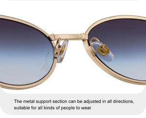 Detail of adjustable nose pads on gold metal frame sunglasses with gradient lenses