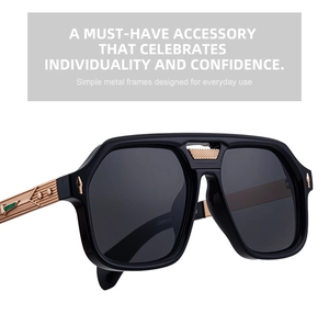 Detail of square black sunglasses featuring antique bronze metal temples with embossed patterns