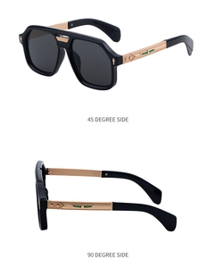 Detail view of square pilot sunglasses with gold metal temples and green wing logo