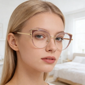 Fashionable cat-eye glasses for women featuring gold metal frames and purple accents