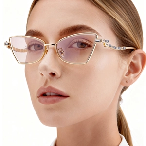 Fashion cat-eye sunglasses for women with golden metal frame and sparkling crystal rhinestones