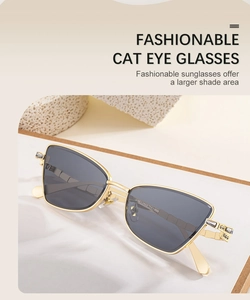 Detail of cat eye sunglasses with gold metal frame and sparkling crystal accents