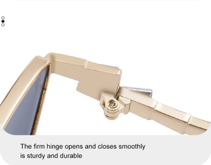 Close-up of a durable gold metal hinge on fashion sunglasses for smooth opening