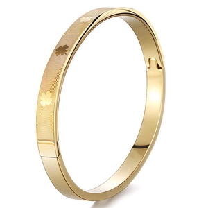 Gold-plated stainless steel bangle featuring geometric patterns and clover motifs