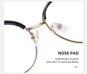 Detail of adjustable transparent nose pads on gold metal frame cat-eye glasses