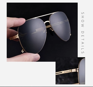 Macro shot of durable metal hinges and polarized nylon lenses on aviator sunglasses