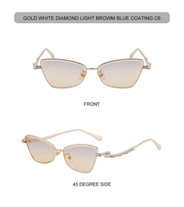 Detail of cat eye sunglasses with gold metal frame, white diamonds and blue coating