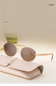 Detail view of oval polarized sunglasses with TAC lenses and leather folding case