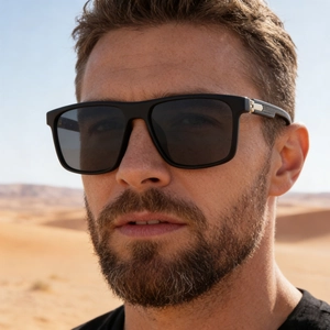 Close-up of black square polarized sunglasses on male model with metallic temple details