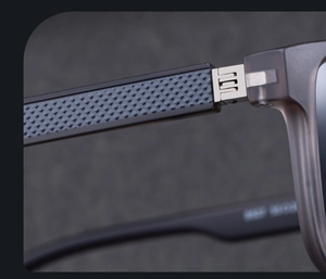 Macro view of polarized sunglasses with silver metal hinge and non-slip textured temples