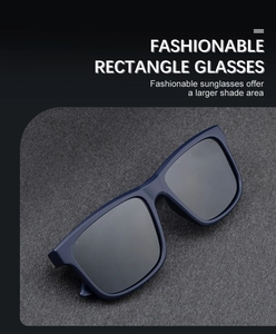 Close-up of stylish rectangular polarized sunglasses with large blue frame and dark lenses
