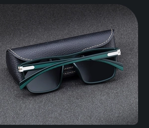 Detail of square polarized sunglasses with green mesh textured temples and leather case