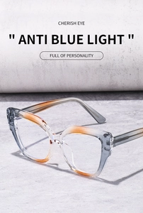 Detail view of cat eye anti blue light glasses with orange gradient frames