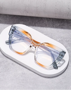 Close-up of cat-eye eyewear showing the high-quality gradient frame and temple engraving