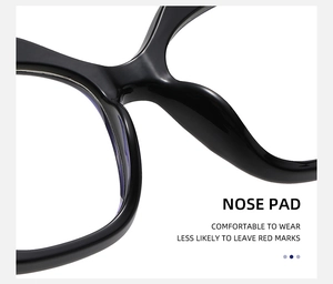 Detail of ergonomic integrated nose pads on black cat-eye glasses for comfort