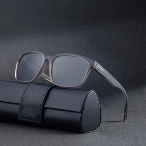 Square polarized sunglasses in translucent grey with patterned arms and leather case