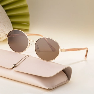 Fashionable oval polarized sunglasses with thin gold frames and brown lenses for women