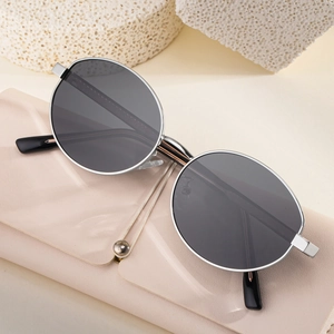 Fashionable oval polarized sunglasses with silver metal frame and dark grey lenses